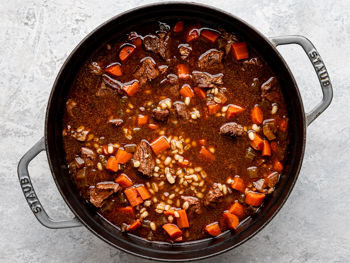 Cooked beef and barley soup in Dutch Oven. 