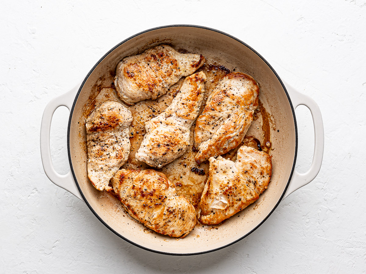6 pieces of chicken breasts browned in large white skillet.