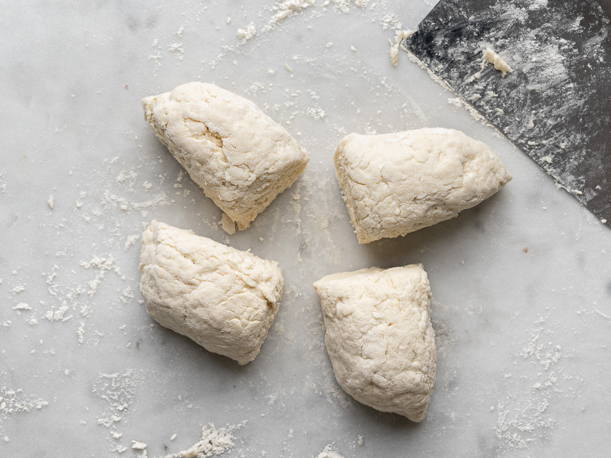 Dough ball divided in 4 pieces.
