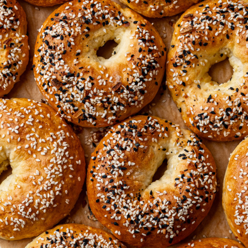 Multiple baked cottage cheese bagels with everything but the bagel topping.