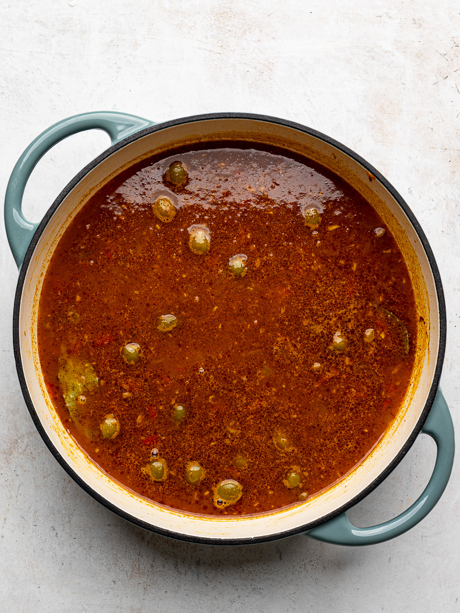 Pot with liquid and uncooked rice. 