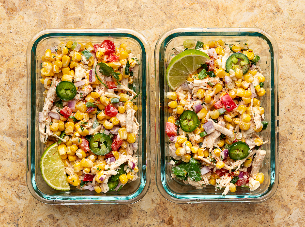 Assembled chicken salad in two glass containers for meal prep. 