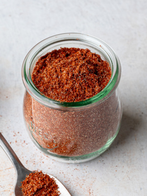 A homemade sazón seasoning in a glass Weck jar.