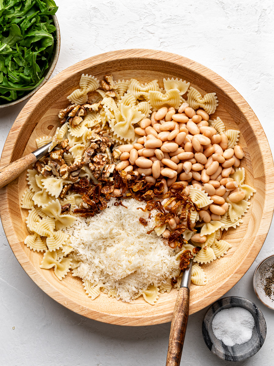 Separated salad ingredients in wooden bowl. 