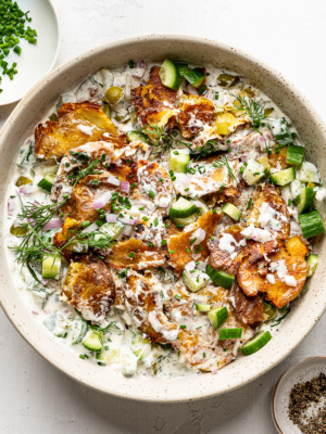 Crispy smashed potato salad garnished with fresh dill. An easy side dish for cookouts and picnics.