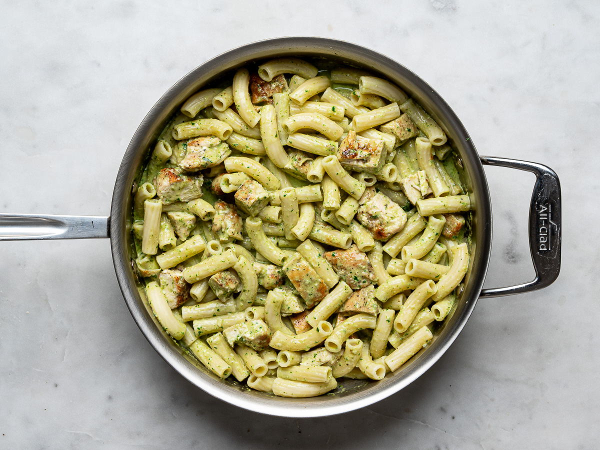 Chicken pesto pasta in skillet.