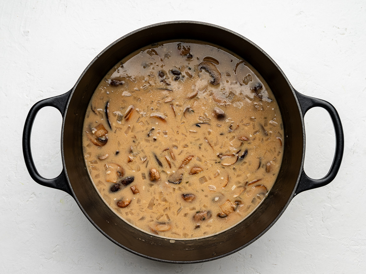 Cooked mushroom soup in pot ready to be blended.