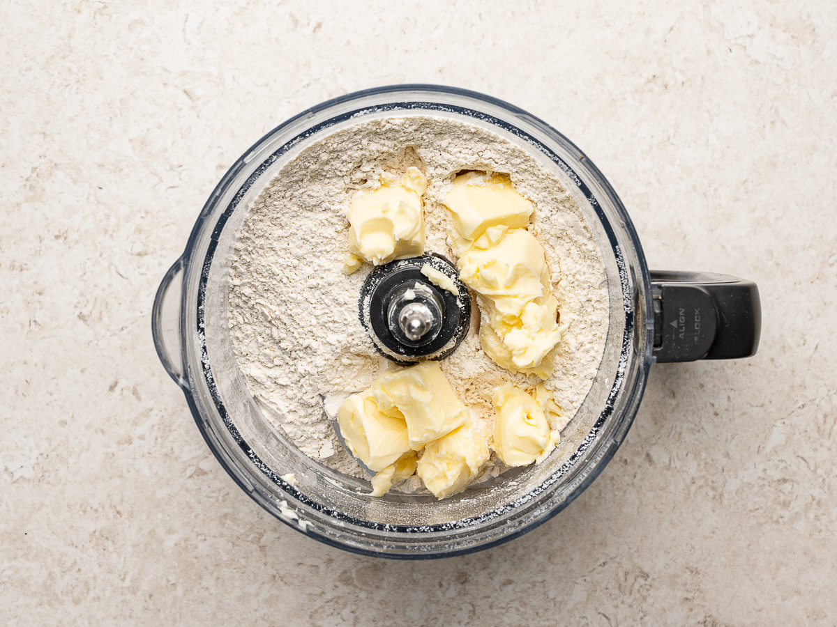 Flour and butter pieces in food processor.