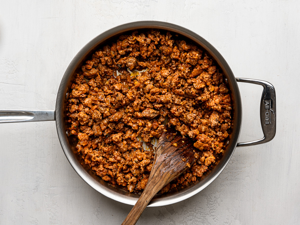 Sautéed sausage mixture in skillet.
