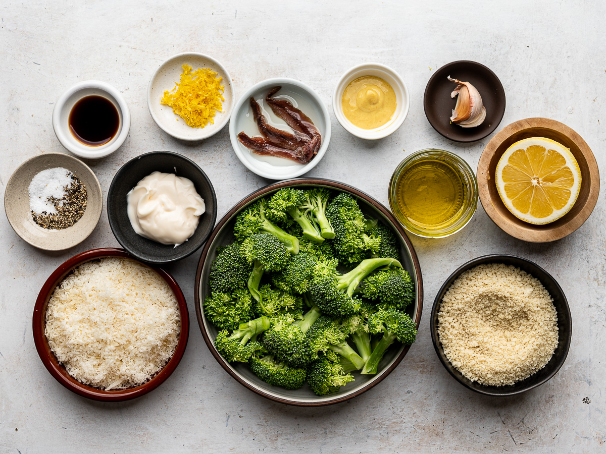 Ingredients for the broccoli caesar salad prepared in individual bowls.