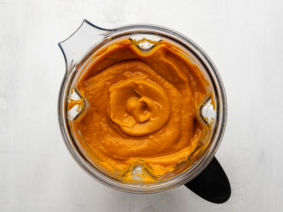Silky, blended sheet pan vegetable soup in a high-speed blender, ready to serve.