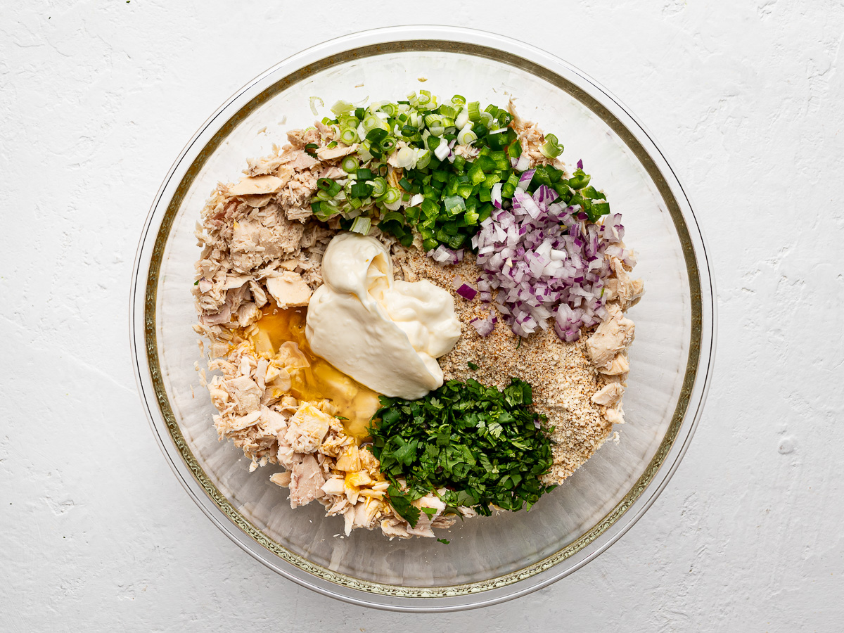 Flaked tuna and all other ingredients in glass mixing bowl.