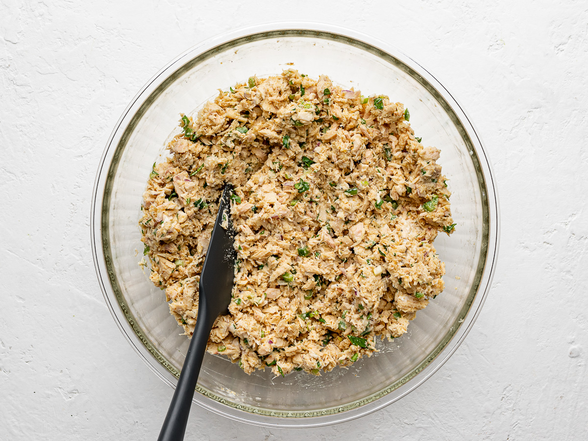 Tuna mixture mixed in glass bowl.