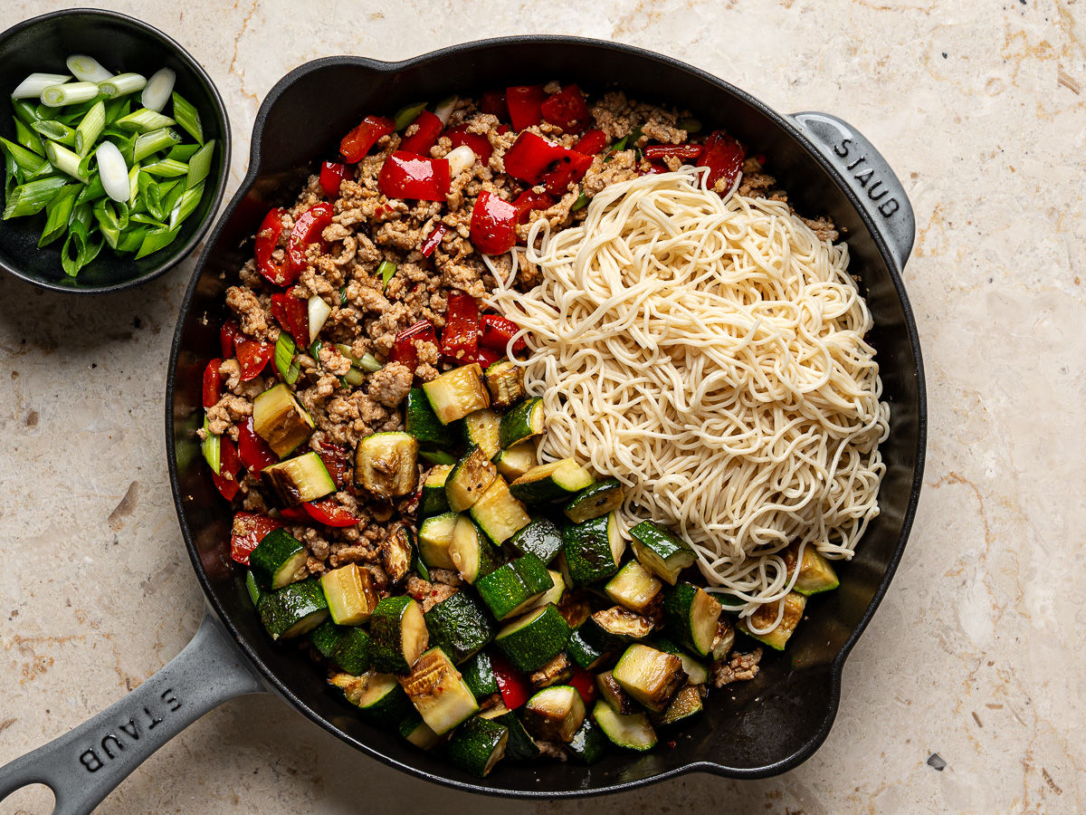 Cooked zucchini and ramen noodles added back into the skillet.