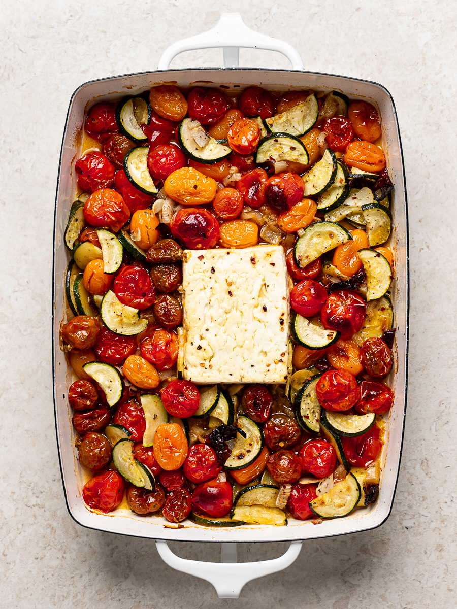 Feta and cherry tomato mixture baked in baking dish.