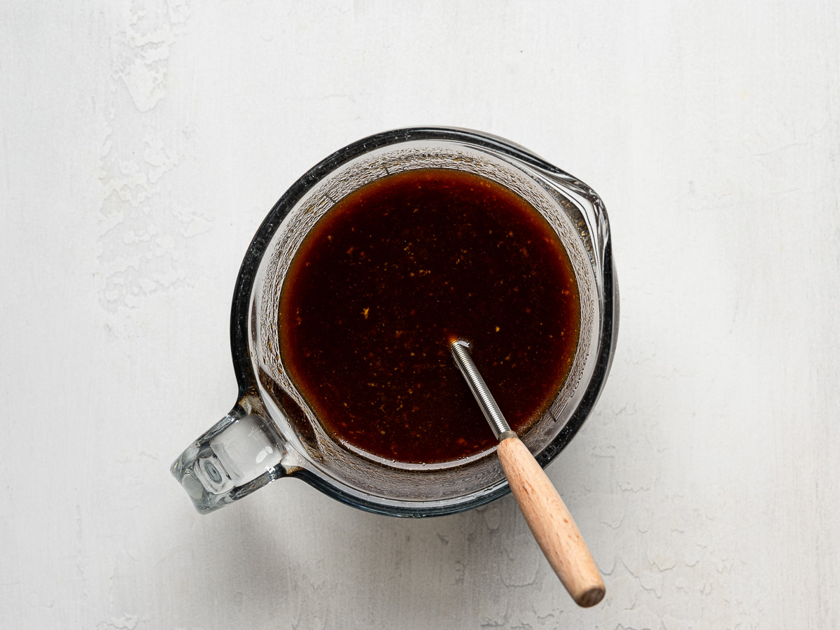 Marinade mixed in measuring cup.