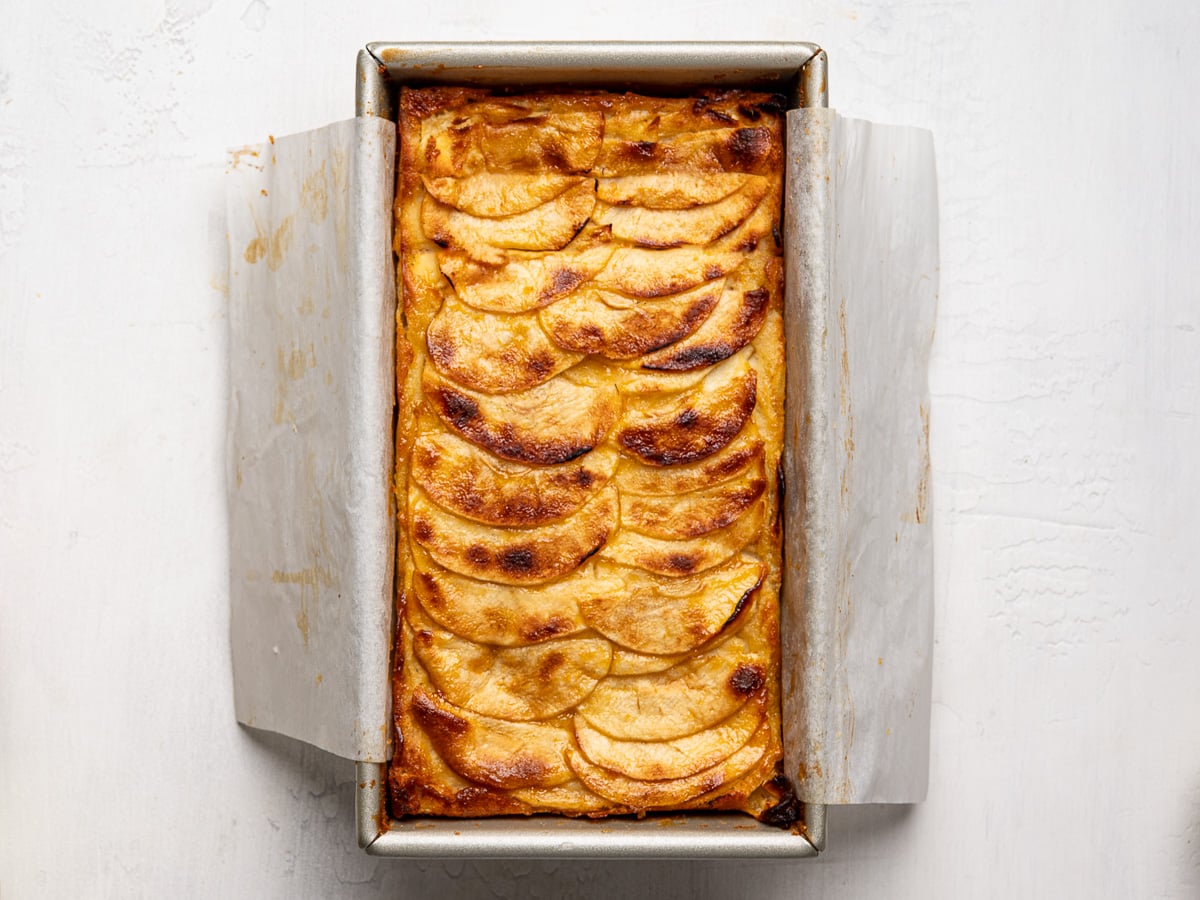 Baked invisible apple cake in loaf pan.