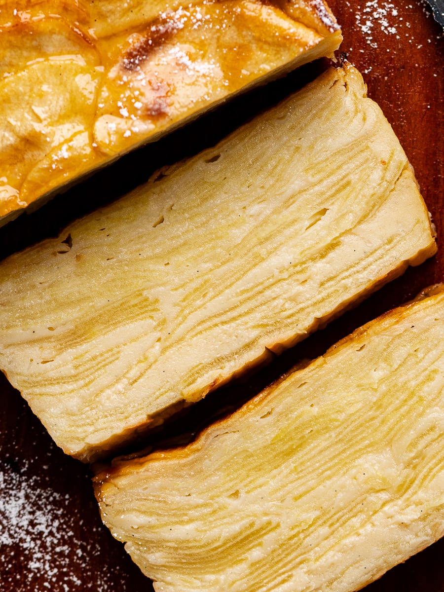 Closeup of two sliced pieces of French apple cake.